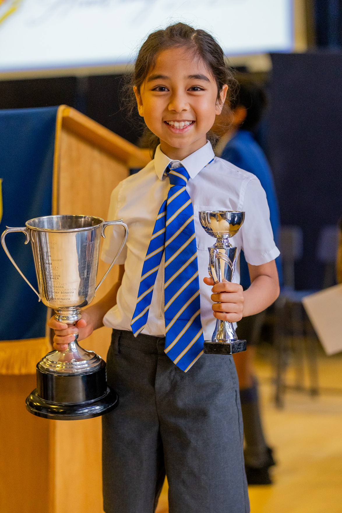 Loyola boy with his trophies