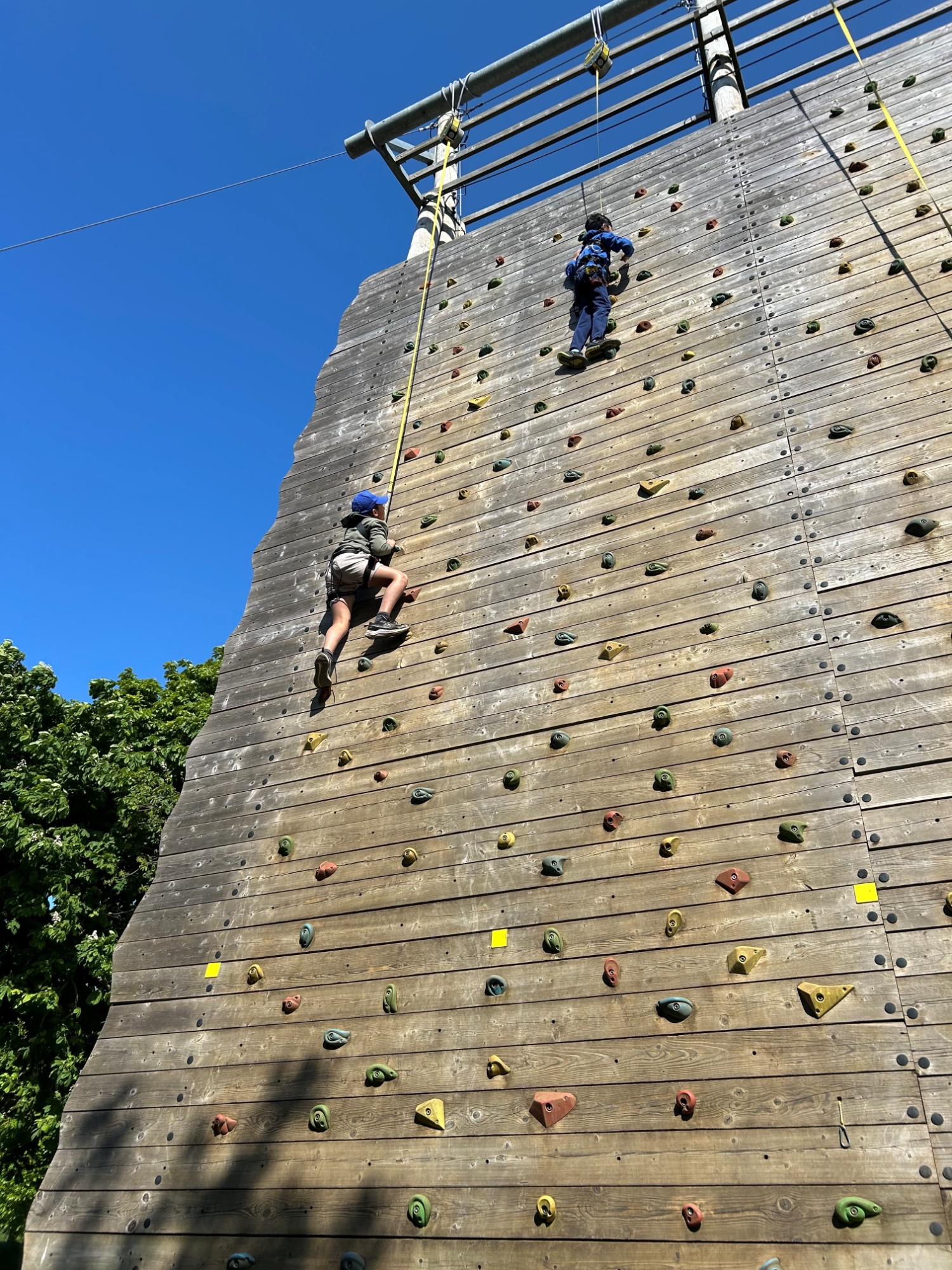 Loyola boys climbing a wall