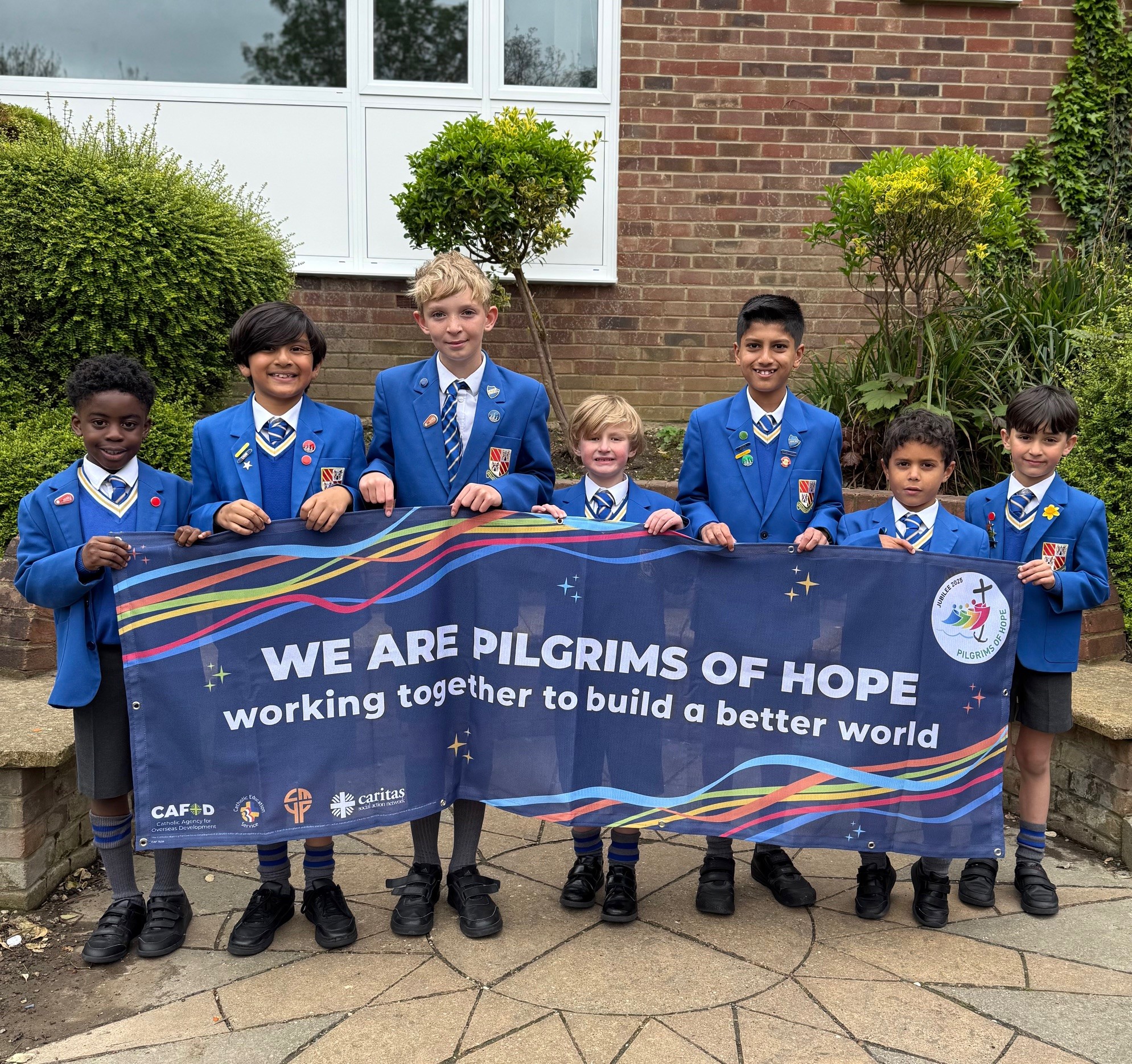 Loyola Prep boys with banner